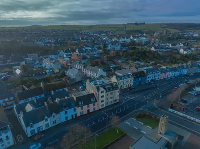 an aerial view of a city with blue buildings at Quay Head View Aparthotel in Stranraer