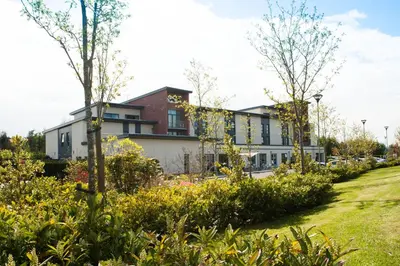 a house with a garden in front of it at Smiths At Gretna Green Hotel in Gretna Green