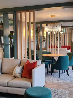 a living room with a couch and a table at Smiths At Gretna Green Hotel in Gretna Green