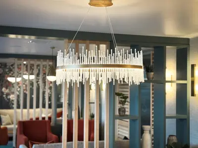 a white chandelier hanging in a living room at Smiths At Gretna Green Hotel in Gretna Green