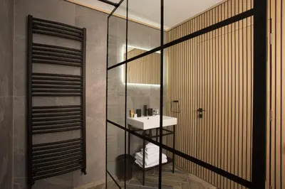 a bathroom with a sink and a mirror at Willowbeck Lodge Boutique Hotel in Carlisle