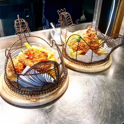 three baskets of food sitting on top of a table at The Lion and The Lamb in Seascale