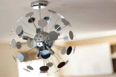 a chandelier hanging from a ceiling in a room at Wordsworth Apartment Irene court in Cockermouth