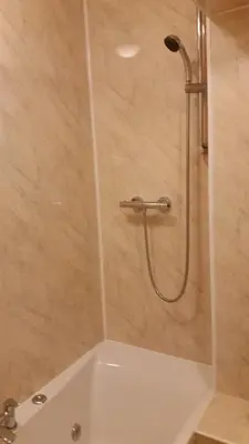 a shower in a bathroom with a tub at Central Dumfries in Dumfries