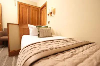 a bed in a hotel room with at The Coledale Inn in Keswick