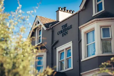 a building with the quarantine inn sign on it at The Coledale Inn in Keswick