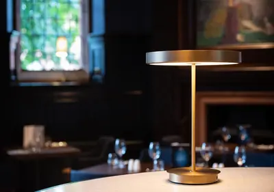 a small lamp sitting on a table in a restaurant at Piersland House in Troon