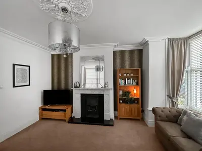 a living room with a couch and a fireplace at Breckenridge in Keswick