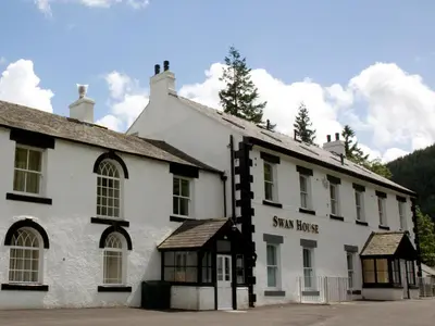 a white building with a sign for a star house at Carrigbaun in Braithwaite