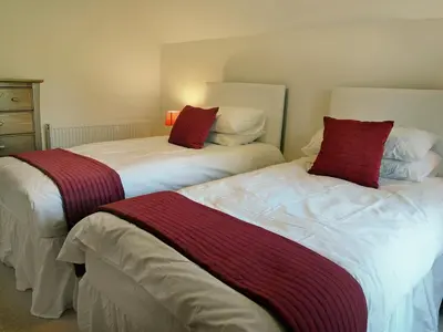 two beds sitting next to each other in a bedroom at Fairview in Rockcliffe