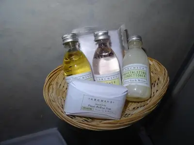 a basket with three bottles of vinegar and milk at Lutwidge Arms in Holmrook