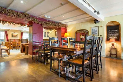 a dining room with a table and chairs at The Traveller's Rest in Grasmere