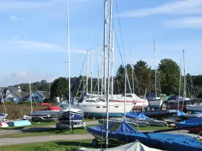 a bunch of boats are parked in a field at The Mariner Hotel in Kippford