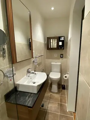 a bathroom with a sink and a toilet at Westwood - The B&B with a view in Cockermouth