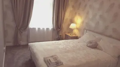 a bedroom with a bed with a ball on it at Dumfries Central apartment in Dumfries