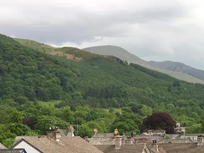 a group of houses in front of a mountain at Blencathra House in Keswick