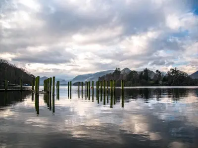a body of water with poles in the water at Bunbury Cottage in Keswick