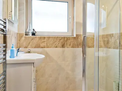 a bathroom with a sink and a shower at Wendover in Keswick