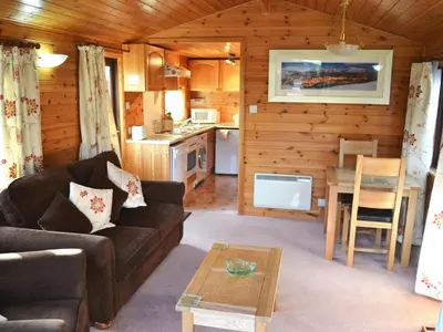 a living room with a couch and a table at Ashness in Keswick