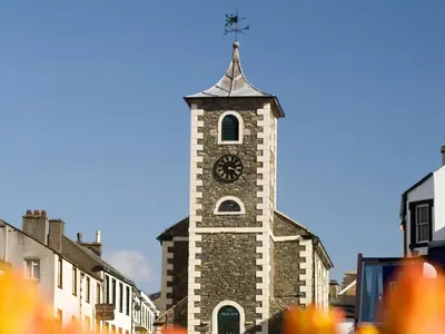 a tall tower with a clock on top of it at Serendipity in Keswick