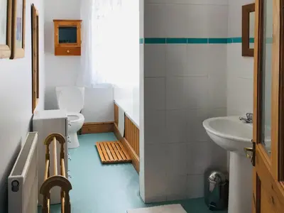 a bathroom with a toilet and a sink at 3 Catherine Cottages in Keswick