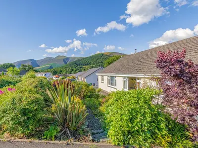 a house with a garden of plants and flowers at Blencathra Bank in Keswick