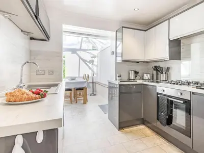 a kitchen with a bowl of fruit on a counter at Blencathra Bank in Keswick