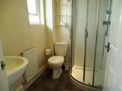 a bathroom with a toilet and a sink and a shower at Carthwaite in Keswick