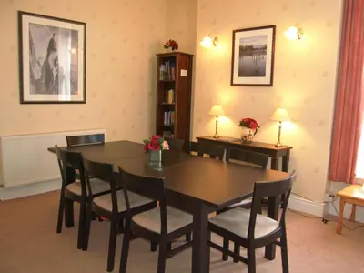 a dining room with a table and chairs at Kingstarn in Keswick