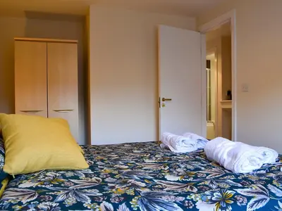 a bed with two pillows sitting on top of it at Bleaberry- Hewetson Court in Keswick