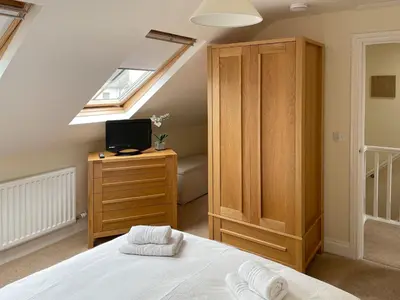 a attic bedroom with a bed and a skylight at The Old Laundry 3 in Keswick