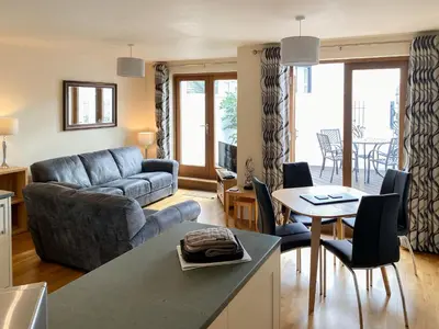 a living room with a couch and a table at The Old Laundry 4 in Keswick