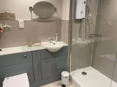 a bathroom with a sink and a shower at Limetrees in Keswick