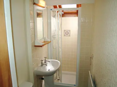 a bathroom with a sink and a shower at Laal Yan in Keswick