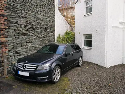 a black car parked next to a building at Hastings in Keswick