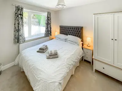 a bedroom with a bed with towels on it at The Croft in Keswick