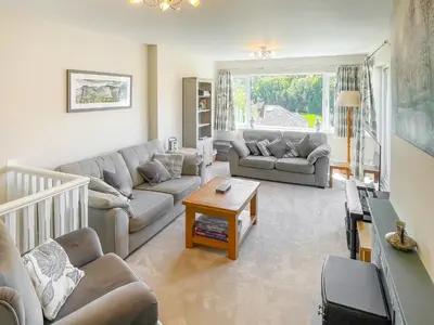 a living room with a couch and a table at The Croft in Keswick