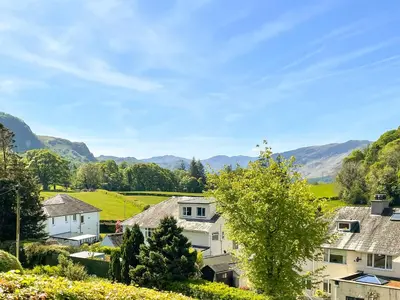 a view of a village with mountains in the background at The Croft in Keswick
