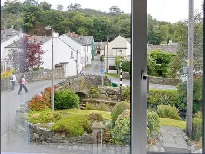 a view of a street from a window at Bridge Cottage in Braithwaite