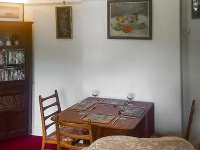 a dining room table with wine glasses on it at Oak Lea in Braithwaite