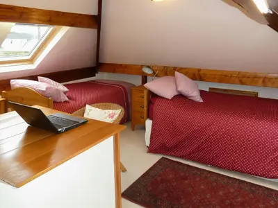 a room with a laptop on a desk and a bed at Bracken Howe in Portinscale