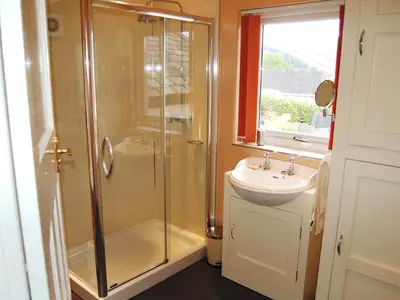 a bathroom with a shower and a sink at Bracken Howe in Portinscale