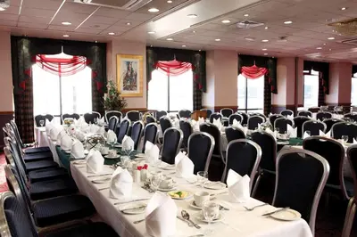 a conference room with a long table and chairs at Best Western Palace Hotel & Casino in Douglas