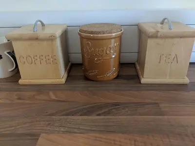 a group of three coffee containers sitting on a floor at Barholm Accommodation in Creetown