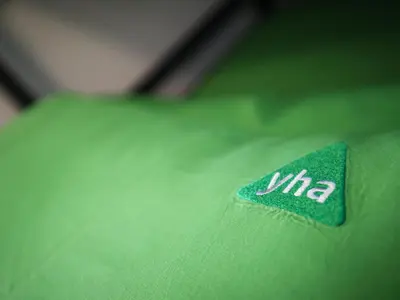a green shirt with the word via on it at YHA Keswick in Keswick