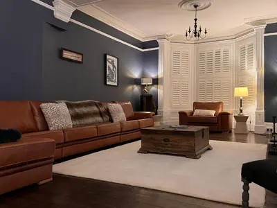 a living room with a couch and a coffee table at Amadeus Apartments in Douglas