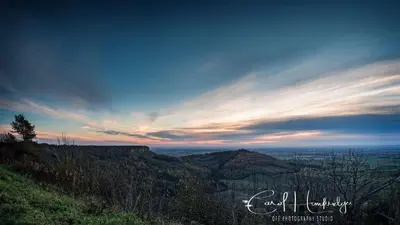a view from the top of a hill at sunset at Bakers Cottage in Cockermouth
