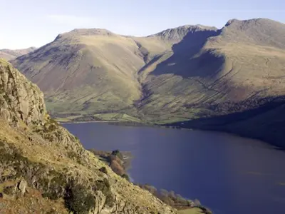 a view of a mountain with a body of water at William Court Cottage in Santon Bridge