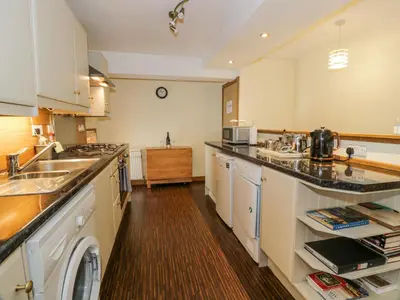 a kitchen with a sink and a counter top at The Old Brewery Store in Gatehouse of Fleet