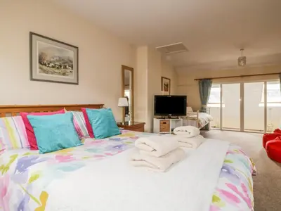 a bedroom with a bed with towels on it at Castlerigg in Keswick
